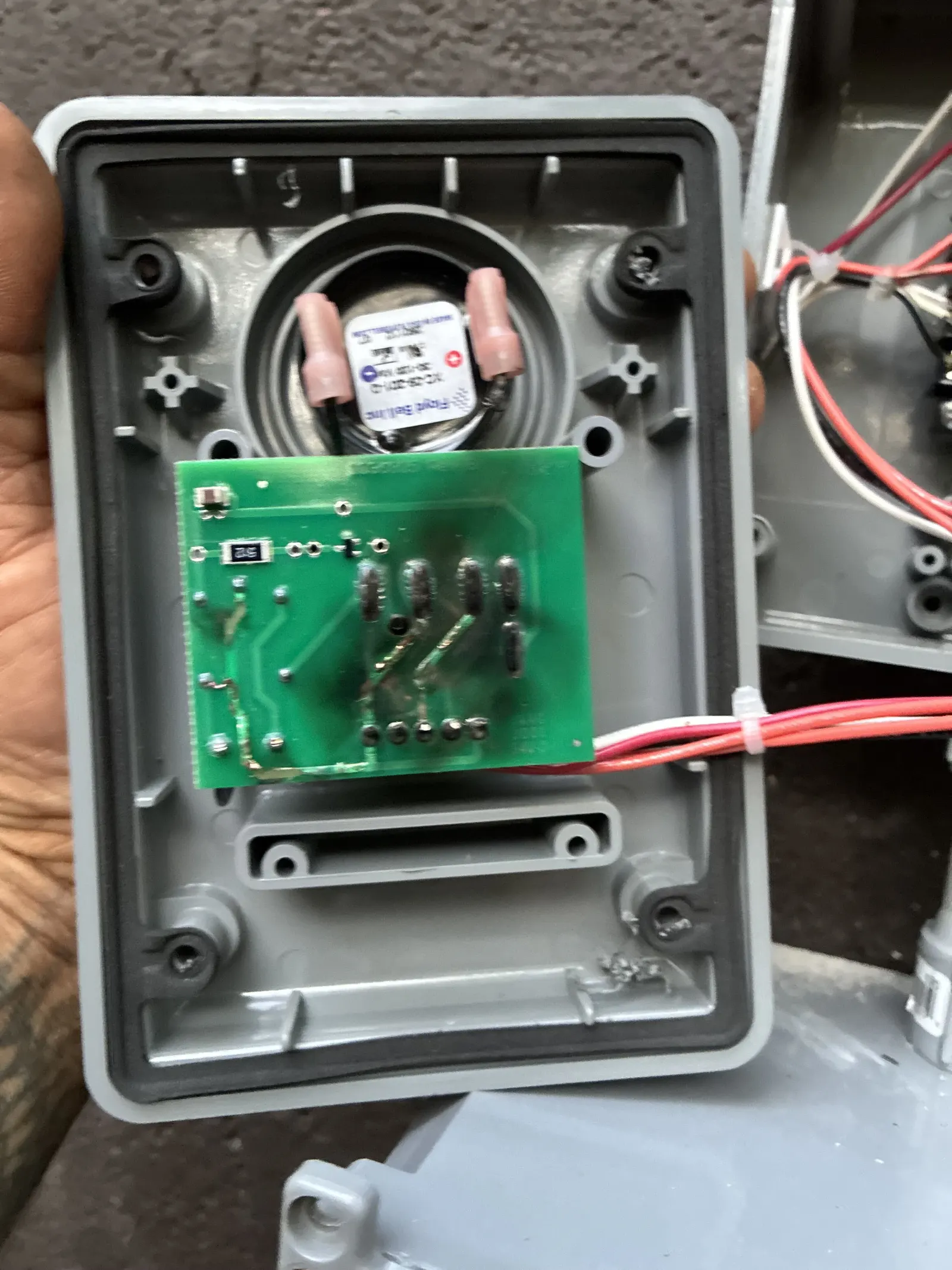 Septic alarm control panel opened to show the circuit board