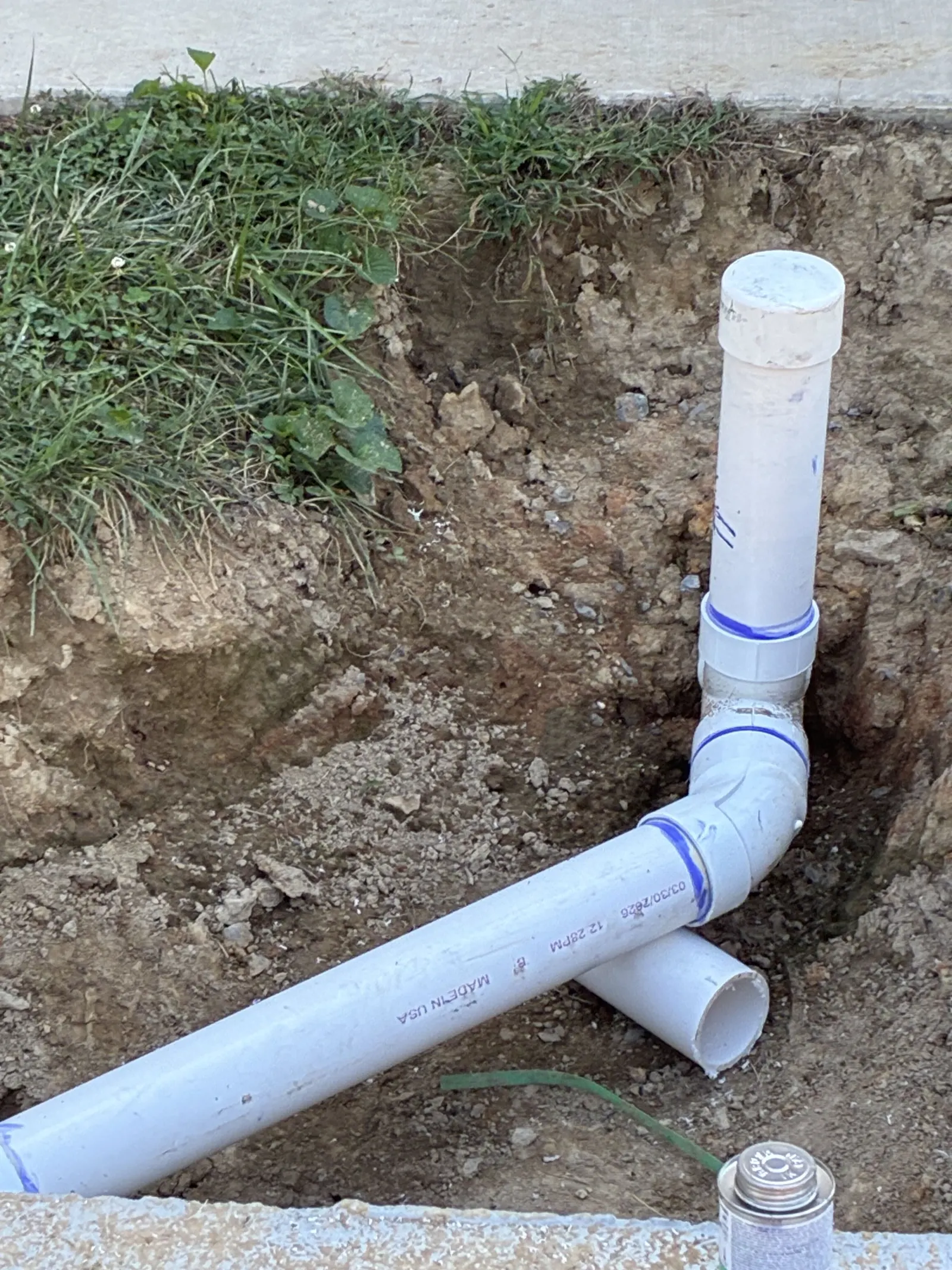 New cleanout riser and pipe in a trench